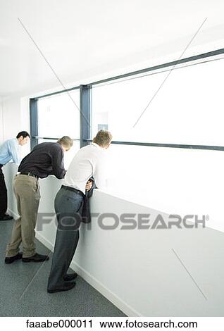 Stock Image - looking, standing, standing up, male, males, executive. Fotosearch