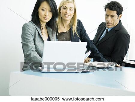 Stock Photography - looking, woman, females, male, males, working. Fotosearch