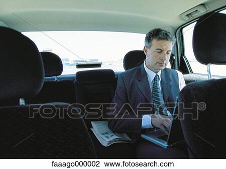 Stock Image - male, males, computer, computers, car, cars. Fotosearch