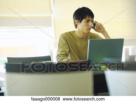 Stock Photo - male, males, phoning, on the phone, using phone, talking on phone. Fotosearch