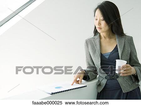 reading, woman, females, document, documents, dark haired, brunette View Large Photo Image Stock Photography - reading, woman, females, document, documents, dark haired, brunette. Fotosearch