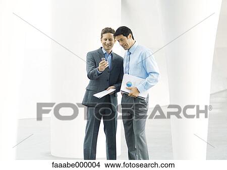 Picture - standing, standing up, male, males, showing, team. Fotosearch