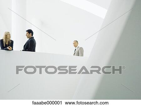 Stock Image - talking, woman, females, male, males, executive. Fotosearch