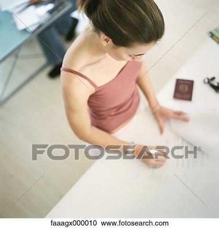 Stock Image - woman, females, document, documents, signature, signatures, signing. Fotosearch