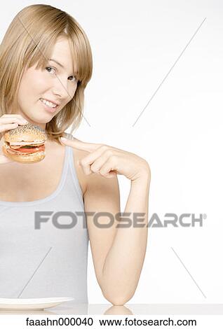 woman, females, food, sandwich, pointing, holding, food and drink View Large Photo Image Stock Image - woman, females, food, sandwich, pointing, holding, food and drink. Fotosearch