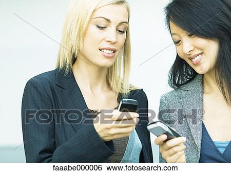 Stock Photograph - woman, females, phone, phones, telephone, telephones, cell phone. Fotosearch