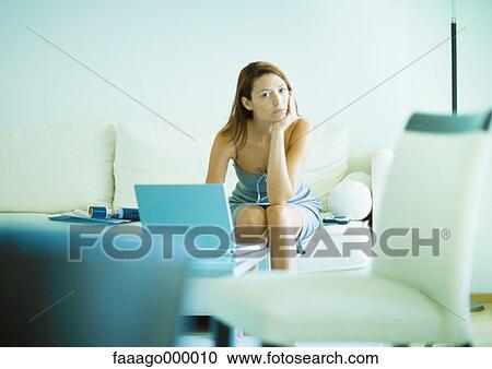 woman, females, sofa, settees, thinking, laptop computer, laptop View Large Photo Image Stock Image - woman, females, sofa, settees, thinking, laptop computer, laptop. Fotosearch