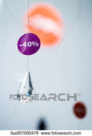 -40% sign hanging on crystal pendant View Large Photo Image Stock Photo - -40% sign hanging on crystal pendant. Fotosearch