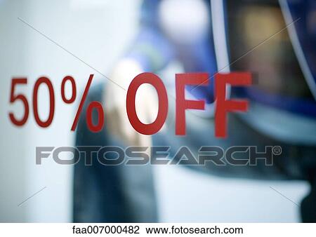 Stock Image - 50% off sign on store window. Fotosearch