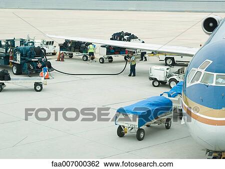 Airplane being fueled up at departure gate View Large Photo Image Stock Image - Airplane being fueled up at departure gate. Fotosearch