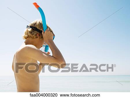 Boy adjusting snorkel View Large Photo Image Stock Image - Boy adjusting snorkel. Fotosearch