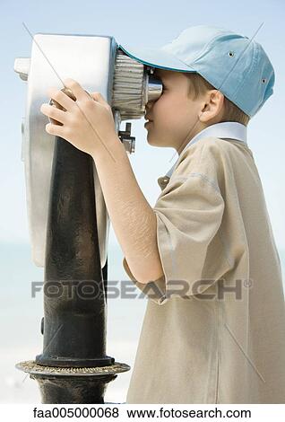 Stock Photo - Boy looking through pay binoculars. Fotosearch