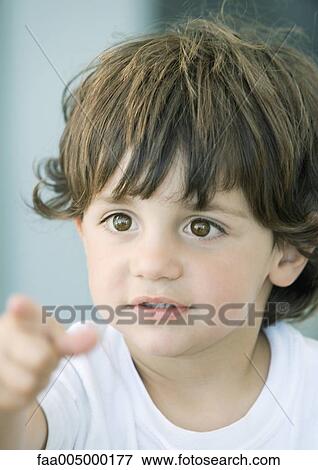 Boy pointing, portrait View Large Photo Image Stock Photo - Boy pointing, portrait. Fotosearch