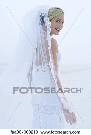 Bride looking over shoulder View Large Photo Image Stock Photo - Bride looking over shoulder. Fotosearch