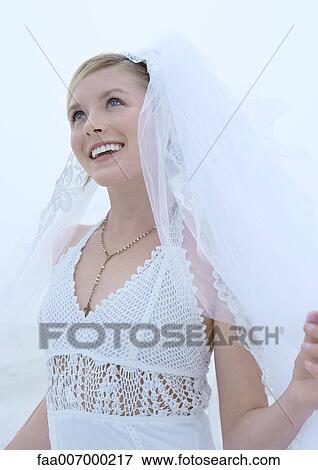 Bride looking up, waist up View Large Photo Image Stock Photo - Bride looking up, waist up. Fotosearch