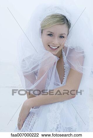 Stock Image - Bride smiling, portrait. Fotosearch