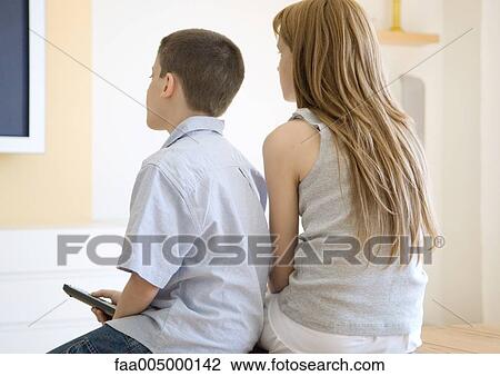 Brother and sister watching tv together View Large Photo Image Stock Image - Brother and sister watching tv together. Fotosearch