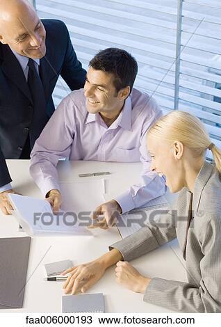 Business people laughing in meeting, high angle view View Large Photo Image Stock Image - Business people laughing in meeting, high angle view. Fotosearch