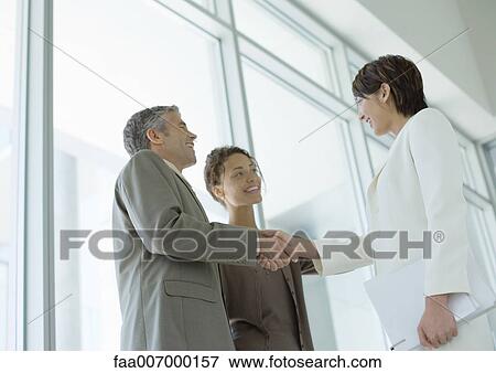 Business people shaking hands View Large Photo Image Stock Photo - Business people shaking hands. Fotosearch