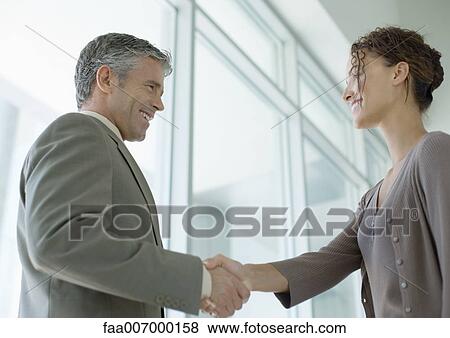 Business people shaking hands View Large Photo Image Stock Photo - Business people shaking hands. Fotosearch