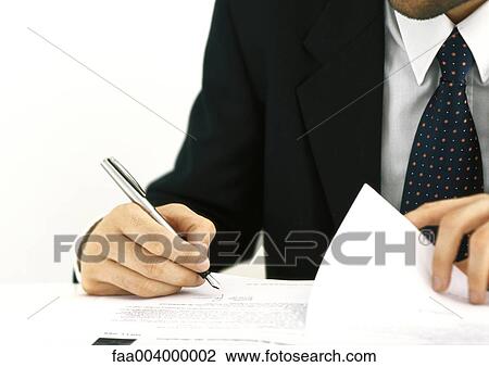 Businessman signing documents View Large Photo Image Stock Image - Businessman signing documents. Fotosearch
