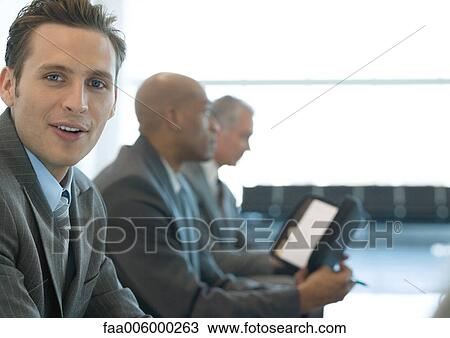 Businessman smiling at camera View Large Photo Image Stock Image - Businessman smiling at camera. Fotosearch