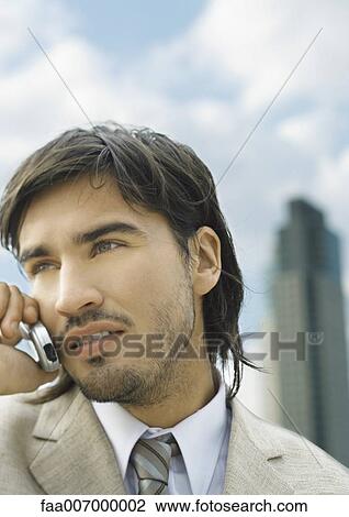 Businessman using cell phone View Large Photo Image Stock Image - Businessman using cell phone. Fotosearch