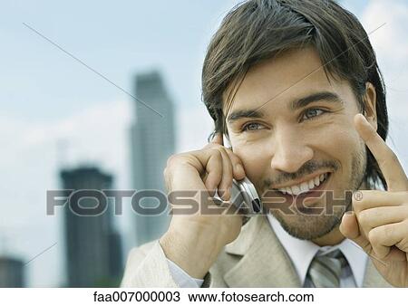 Businessman using cell phone View Large Photo Image Stock Image - Businessman using cell phone. Fotosearch