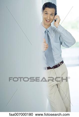 Businessman using cell phone View Large Photo Image Stock Image - Businessman using cell phone. Fotosearch