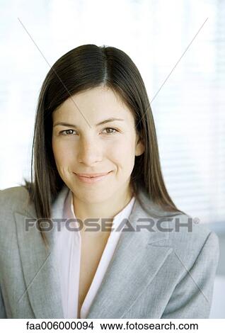 Businesswoman looking at camera, portrait View Large Photo Image Picture - Businesswoman looking at camera, portrait. Fotosearch