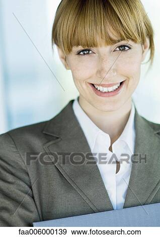 Businesswoman smiling at camera, portrait View Large Photo Image Stock Photo - Businesswoman smiling at camera, portrait. Fotosearch