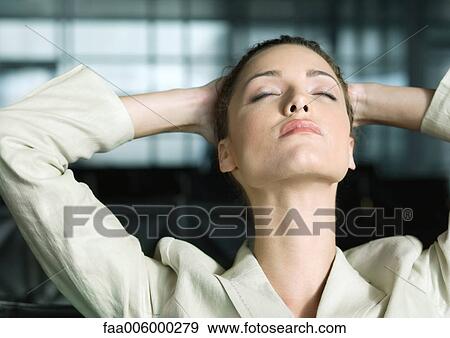 Businesswoman with hands behind head and eyes closed View Large Photo Image Stock Photo - Businesswoman with hands behind head and eyes closed. Fotosearch