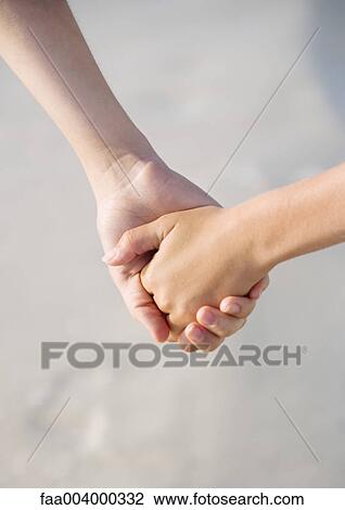 Child holding hands with older sibling View Large Photo Image Stock Image - Child holding hands with older sibling. Fotosearch