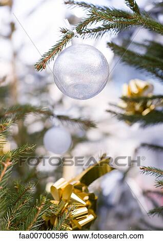 Christmas decoration on tree, close-up View Large Photo Image Stock Photograph - Christmas decoration on tree, close-up. Fotosearch