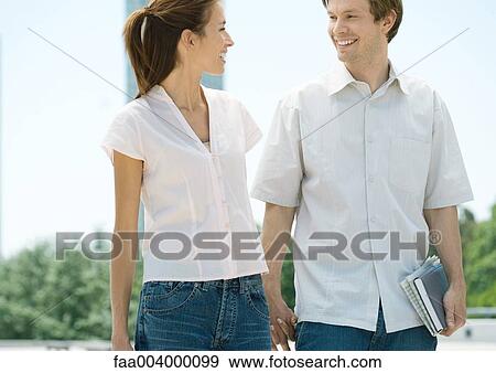 College students walking together View Large Photo Image Stock Photo - College students walking together. Fotosearch