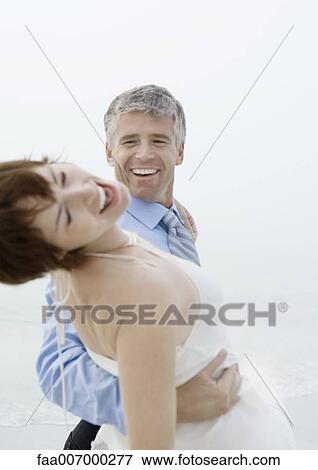 Couple dancing on beach View Large Photo Image Stock Photo - Couple dancing on beach. Fotosearch