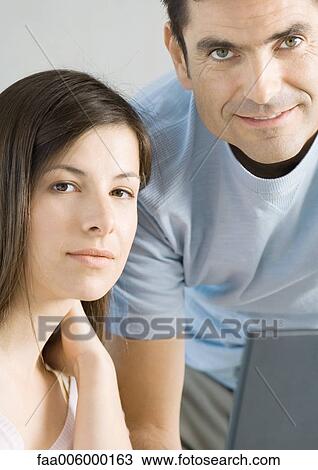 Couple looking at camera, portrait View Large Photo Image Stock Image - Couple looking at camera, portrait. Fotosearch