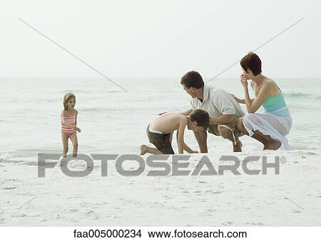 Family at the beach View Large Photo Image Picture - Family at the beach. Fotosearch