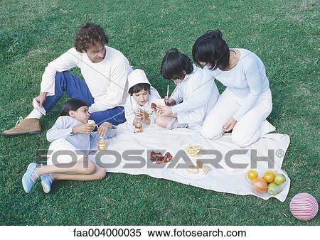 Family having picnic View Large Photo Image Stock Photography - Family having picnic. Fotosearch