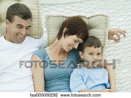 Family relaxing in hammock View Large Photo Image Stock Image - Family relaxing in hammock. Fotosearch