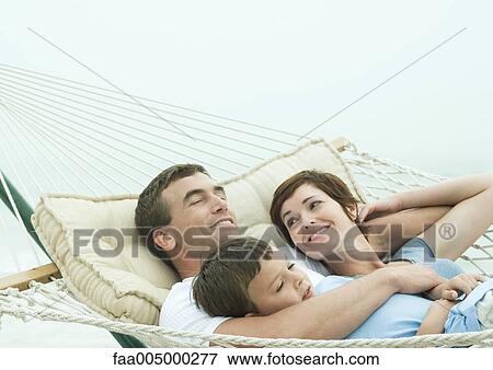 Family relaxing in hammock View Large Photo Image Stock Photo - Family relaxing in hammock. Fotosearch