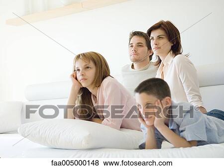 Family watching tv together View Large Photo Image Stock Photo - Family watching tv together. Fotosearch