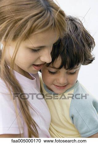Stock Image - Girl and little boy, portrait. Fotosearch