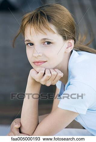 Girl leaning on elbow, portrait View Large Photo Image Stock Image - Girl leaning on elbow, portrait. Fotosearch