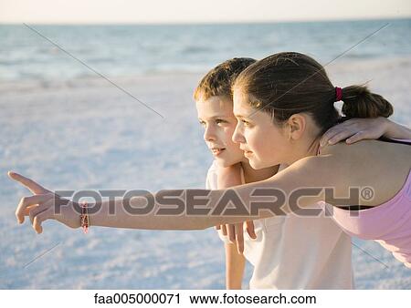 Girl looking at view with younger brother View Large Photo Image Stock Image - Girl looking at view with younger brother. Fotosearch