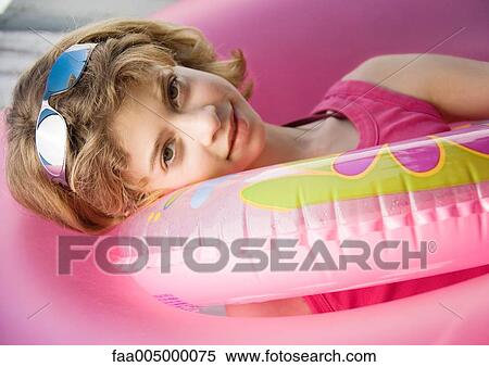 Girl resting in innertube View Large Photo Image Stock Photography - Girl resting in innertube. Fotosearch