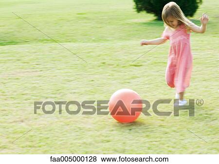 Girl running after ball, blurred motion View Large Photo Image Stock Photo - Girl running after ball, blurred motion. Fotosearch