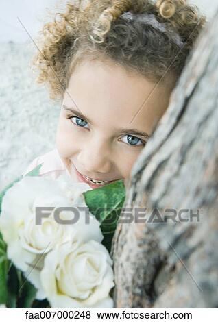 Girl with flowers View Large Photo Image Stock Photo - Girl with flowers. Fotosearch