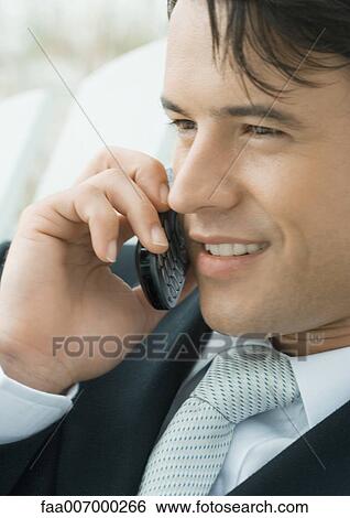 Groom using phone View Large Photo Image Stock Photograph - Groom using phone. Fotosearch