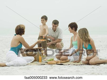 Group having picnic on beach View Large Photo Image Stock Image - Group having picnic on beach. Fotosearch